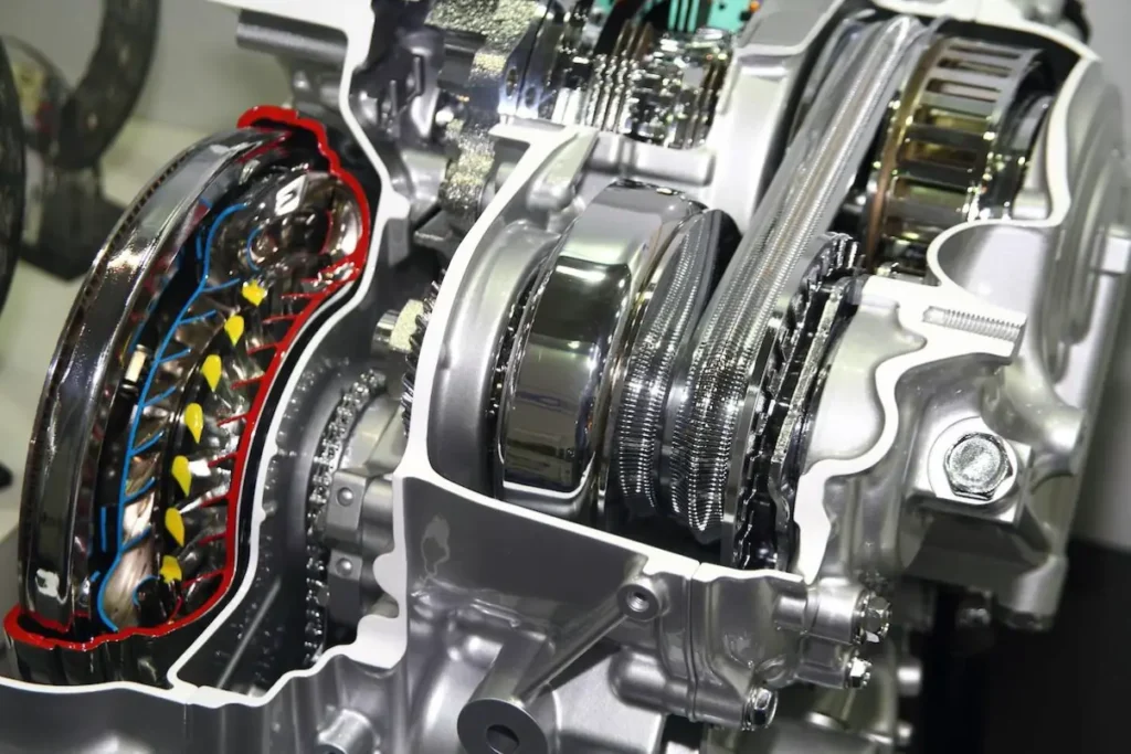 A cutaway view of a Continuously Variable Transmission (CVT), highlighting its two conical pulleys and the steel belt or chain running between them.